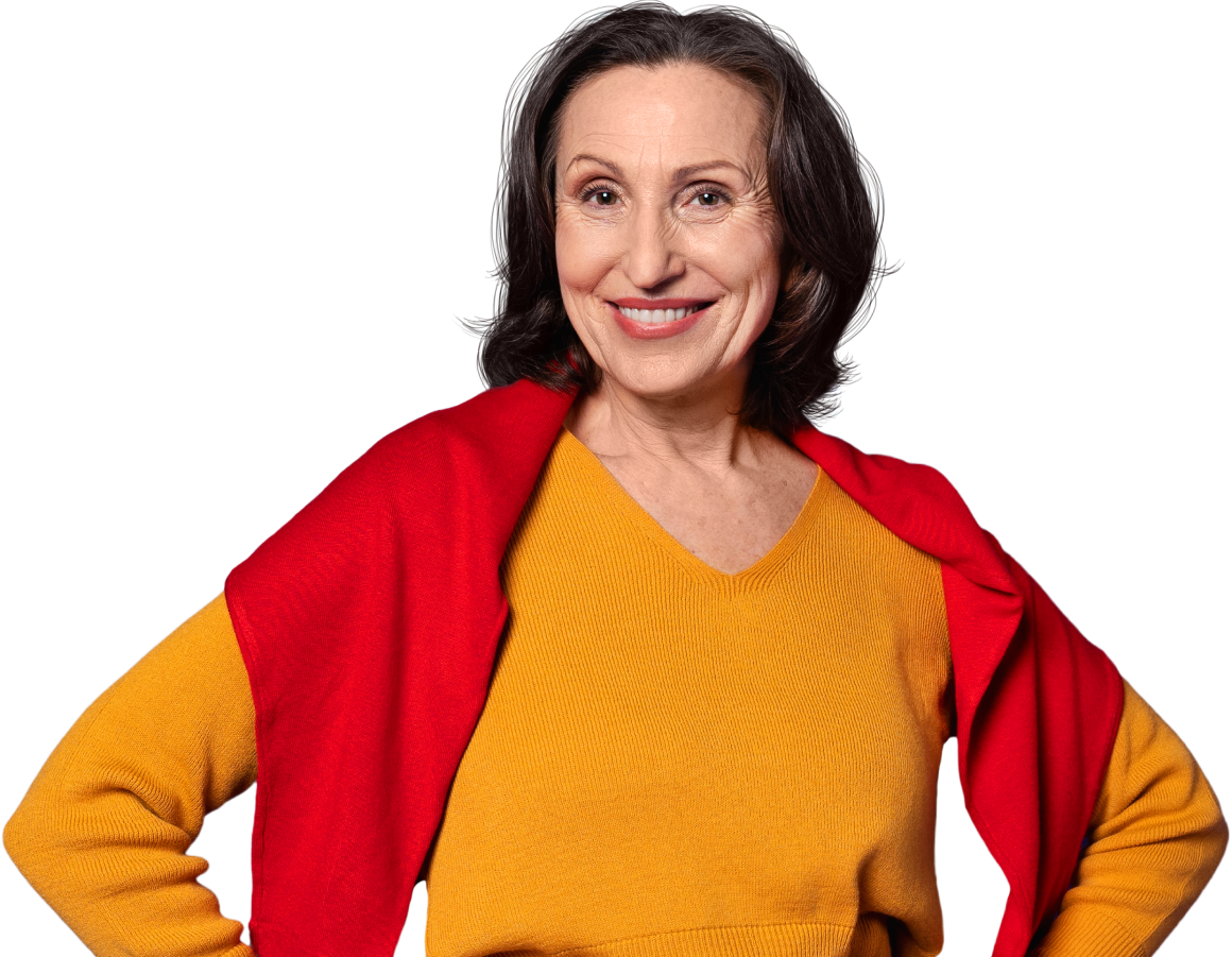 Smiling woman in colorful sweater.