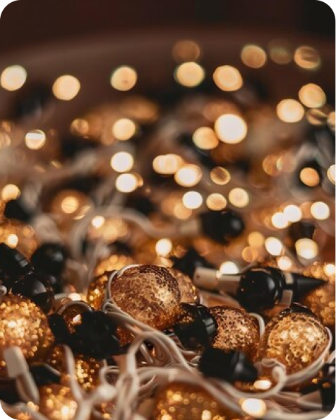 Glowing string lights, blurred background.
