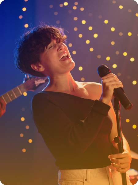 Singer performing on stage.